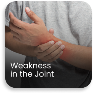 Person holding wrist with highlighted red pain area indicating weakness in the joint, a common symptom of ligament strain, arthritis, or joint instability requiring orthopaedic evaluation.